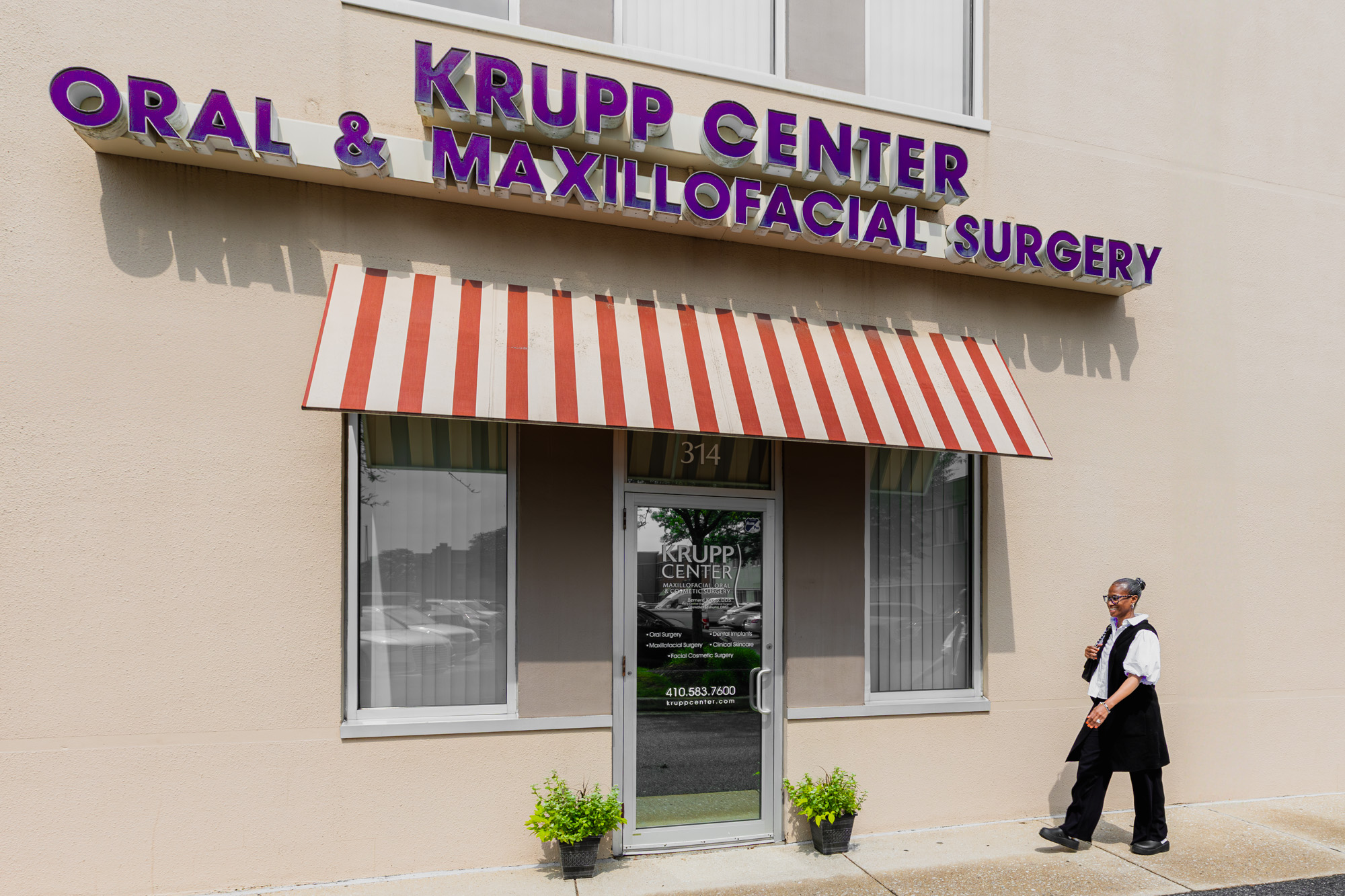 The front entrance of the Krupp Center, a large sign above the front door. The Krupp Center provides surgical dentistry for children in Towson, as well as other dental procedures that may be needed.